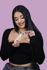 A model using a makeup remover pen to clean her false eyelashes.