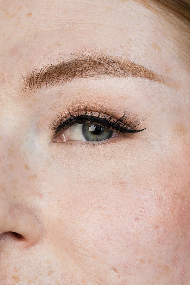 Close up of false eyelash on model. Very wispy and natural looking fake eyelash.